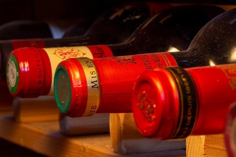 Wine cellar with red wine bottles (editorial)
