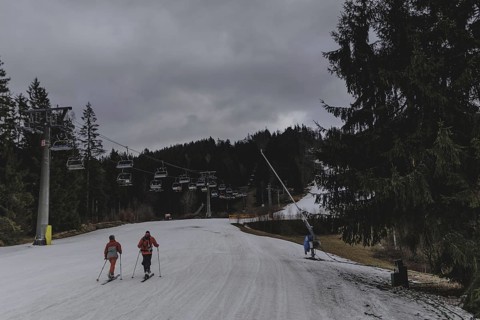 Two ski instructors go on a ski tour, taken on a ski slope in the Jizera Mountains ski area near