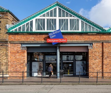McArthur Glen designer outlet west entrance into former railway works, Swindon, Wiltshire, England,