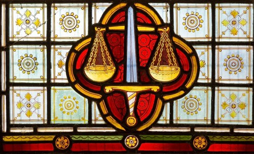 Stained glass window Bedingfield church, Suffolk, England, UK c 1878, detail of scales of justice,