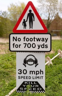 Road traffic signs warning of hazards no footway 30 mph speed limit, Shottisham, Suffolk, England,