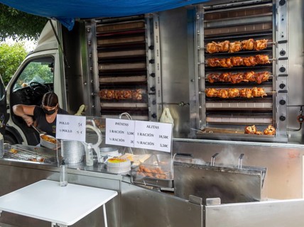 Mobile shop vehicle selling spit roasted chicken products from van, Mojacar, Almeria, Spain, Europe