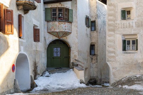 Bay window, entrance door, historic house, sgraffito, facade decorations, Guarda, Engadin, Grisons,