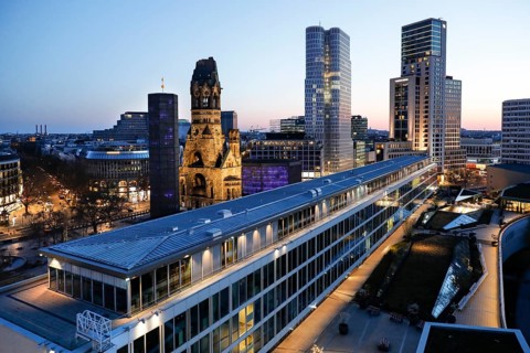 View of Breitscheidplatz in the evening with the Bikini building, the Kaiser Wilhelm Memorial