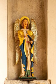 Interior historic village parish church, Wingfield, Suffolk, England, UK statue Angel Gabriel
