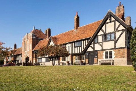 Historic almshouses building in Thorpeness, Suffolk, England, UK