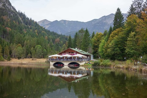 Pflegersee with inn under a cloudy sky, Garmisch-Partenkirchen, Werdenfelser Land, Upper Bavaria,