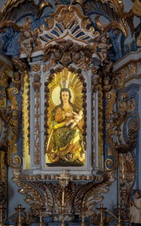 Ornately decorated statue of Blessed Virgin Mary 17th century church of Igreja de Santiago, Tavira,
