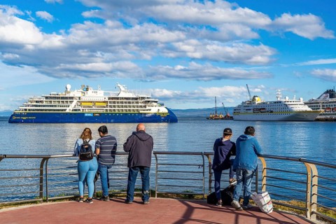 People watching cruise ships in the harbour at the Beagle Channel, Ushuaia, Tierra del Fuego