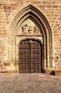 Aragonese Gothic architectural style carvings on and around doorway, Santa Maria la Mayor, Ezcaray,