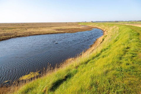 Water in lagoon between shingle beach and sea wall dyke, Alderton, Suffolk, England, UK, North Sea
