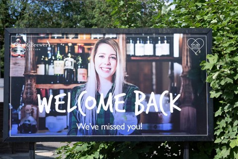 Welcome Back poster sign outside Chef and Brewer pub chain at Martlesham, Suffolk, England, UK July