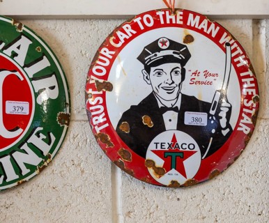 Vintage Texaco oil petrol metal advertising sign on display at auction