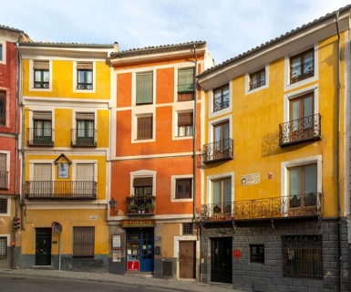 Colourful narrow historic building in a row in old part of city of Cuenca, Castille La Mancha,