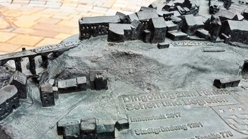 The historic city centre of Dingolfing with a view of the bronze city map. Dingolfing, Lower