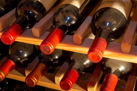 Wine cellar with red wine bottles (editorial)