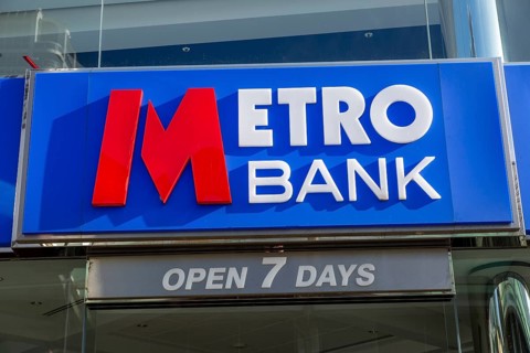 Signs on Metro Bank building, Regent Street, Swindon, Wiltshire, England, UK open 7 days