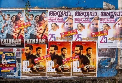Rows of vibrant Indian Bollywood movie posters adorn a wall in Fort Kochi, Cochin, Kerala, India,