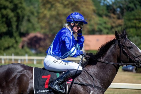 Race day at the racecourse in Hassloch, Palatinate. Galloping out after the Mueller Bau GmbH Prize