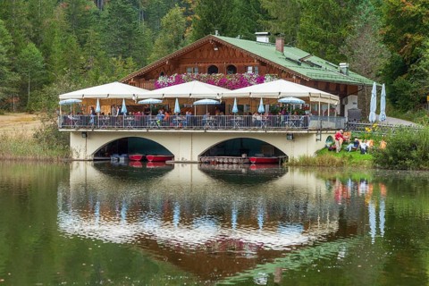 Pflegersee with inn under a cloudy sky, Garmisch-Partenkirchen, Werdenfelser Land, Upper Bavaria,