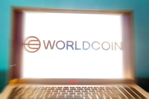 Logo of the new cryptocurrency Worldcoin on a laptop. Anyone wishing to participate in World Coin