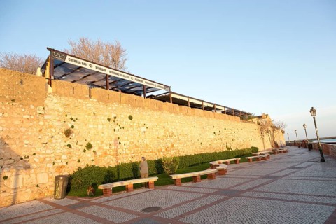 City walls of fortified medieval old town, Cidade Velha, from the waterfront city of Faro,
