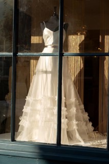 Wedding dress in shop window Amelia and Alci bridal boutique shop, Market Hill, Woodbridge,