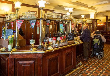 Interior of historic Goat Major pub in city centre of Cardiff, South Wales, UK, bar with Brains
