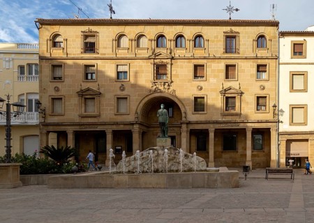 Statue wearing face mask in front of Santander bank, Plaza Andalucia, Ubeda, Spain, Europe