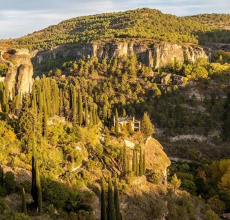 Wooded rocky gorge valley sides with cypress trees, river gorge, Rio Huecar, Cuenca, Castille La
