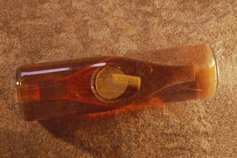 Multiple exposure of a rose wine bottle with wine cork, wine bottle, rose wine, full, view from