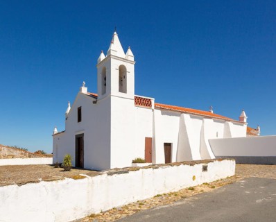 Whitewashed building rural country village catholic church Igreja Santa Barbara de Padroes, near
