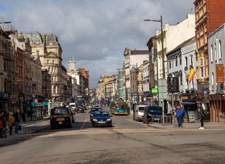 Traffic and people in busy St Mary Street, city centre of Cardiff, South Wales, UK