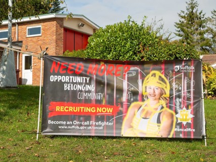 Recruitment advertising poster for on-call firefighters, Holbrook, Suffolk, England, UK