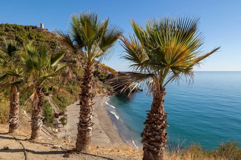 Sandy beach of Playa de Maro, near Nerja, Andalusia, Spain with calm Mediterranean Sea, out of
