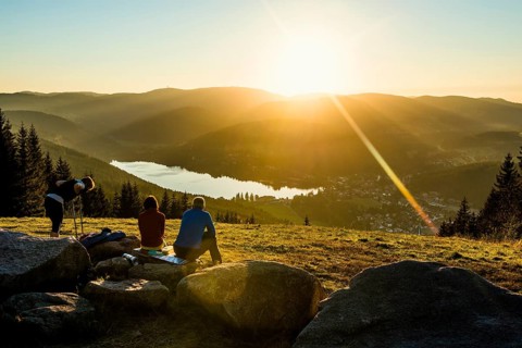 Hiking group, view from Hochfirst to Titisee and Feldberg, sunset, near Neustadt, Black Forest,