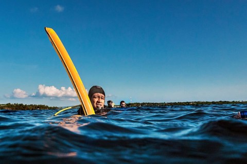 Dive guide with dive buoy, Wakatobi Dive Resort, Sulawesi, Indonesia, Asia