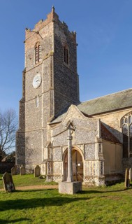 Tower and porch of village church of Saint Michael Tunstall, Suffolk, England, UK