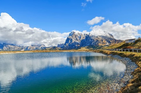 Reservoir with view of the Sassolungo and Sassopiatto, reflection, clouds, Dolomites, Alpe di