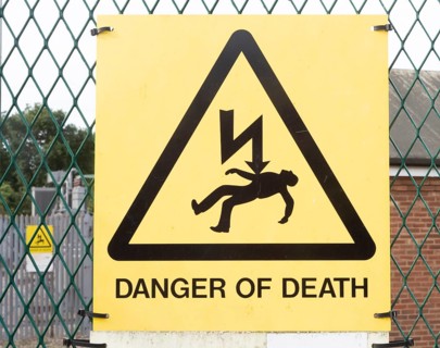 Close up sign Danger of Death at electricity sub station, Knodishall, Suffolk, England, UK