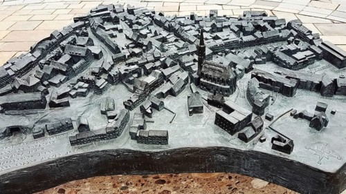 The historic city centre of Dingolfing with a view of the bronze city map. Dingolfing, Lower