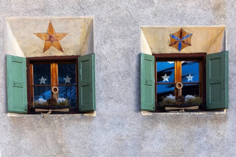 Windows on historic house, sgraffito, facade decorations, shutters, Guarda, Engadin, Grisons,
