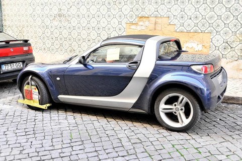 Car with police claw, Parking in no parking zone, Lisbon, Lisboa, Portugal, Europe