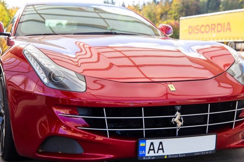 Close-up of a red Ferrari FF (seen at the Ellwanger Berge motorway service area,