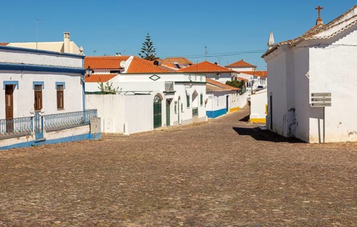 Small traditional rural settlement village with low rise one story houses and cobbled streets,