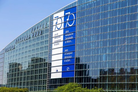 The back of the European Parliament in Strasbourg On the glass facade you can see a huge banner