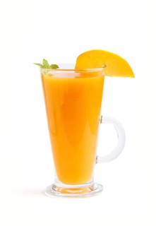 Glass of peach juice isolated on white background. Morninig, spring, healthy drink concept. Side