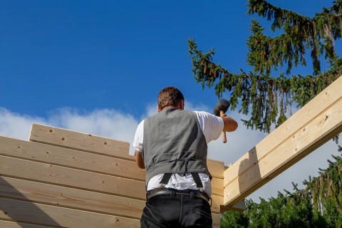 Timber construction: Carpenters assembling a garden sauna in Mutterstadt in the Rhein-Pfalz