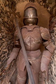Rusty knight's armour with lance in a niche in the outer bailey, Ronneburg Castle, medieval