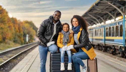 AI generated, A young family wants to travel and waits in the station for the train, 30, 35, years,
